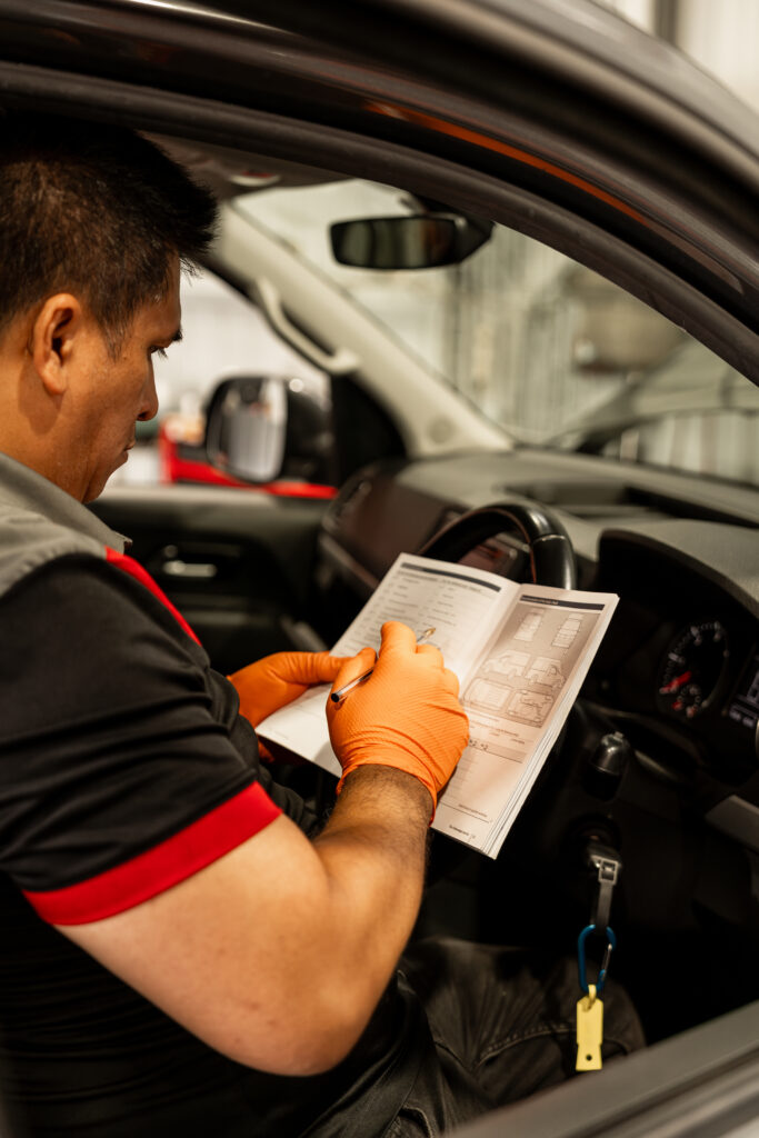expert mechanic doing logbook service for European cars in Woolloongabba